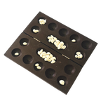 Handcrafted wooden folding Pallanguzhi board with cowrie shells traditional South Indian mancala game