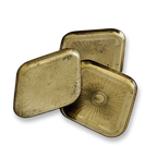 Three Vintage brass trinket platter brass tins with sunburst designs on a white background