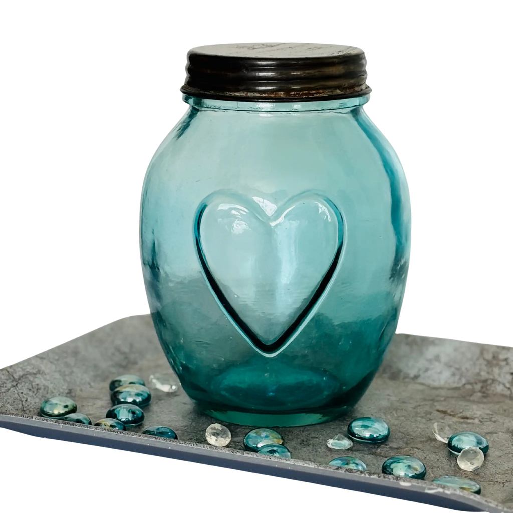 Vintage apothecary bottle with heart embossing and metal lid – decorative glass storage jar