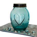 Vintage apothecary bottle with heart embossing and metal lid – decorative glass storage jar
