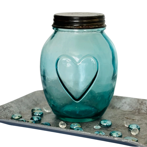 Vintage apothecary bottle with heart embossing and metal lid – decorative glass storage jar